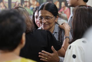 People console mother of Clive Kunder, co-pilot of the Air India Boeing 787-8 Dreamliner plane, which crashed during take-off from an airport in Ahmedabad
